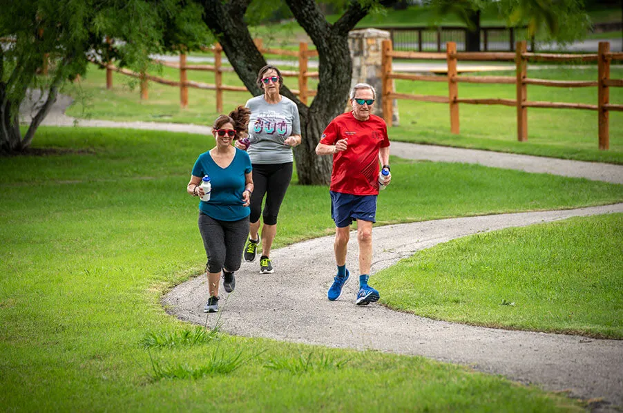 Group of seniors running through the trails at Blue Skies of Texas.