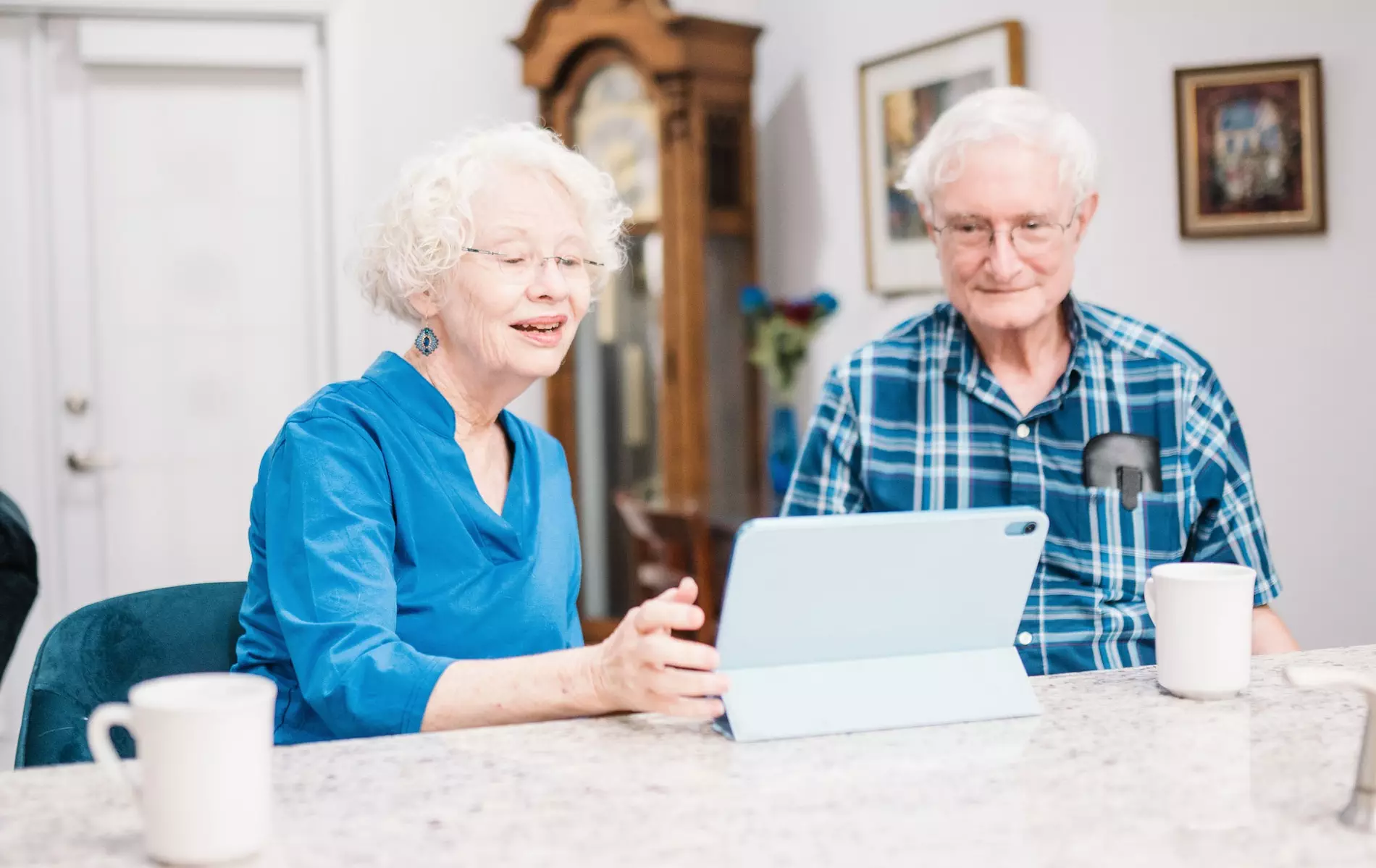 Senior couple looking at tablet