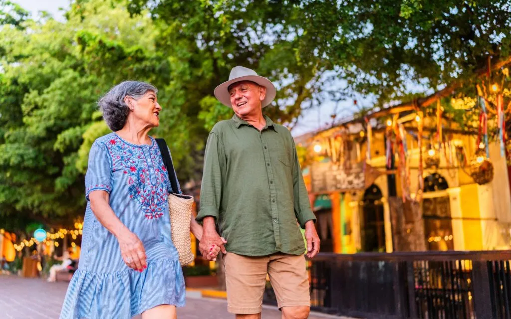 Senior couple walking outside